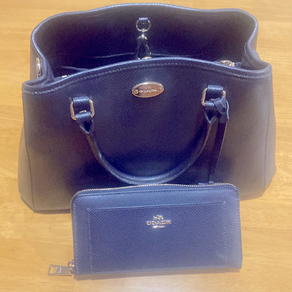 Coach purse and matching wallet. Never carried. Wallet is a zip around. NWOT